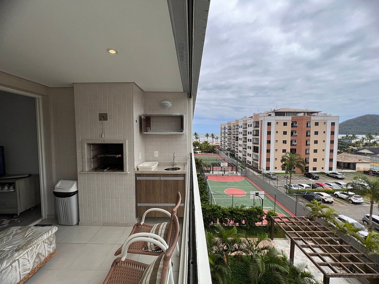 Home 12| Ap piscina aquecida pé na areia Bertioga