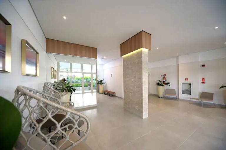 Home 12| Ap piscina aquecida pé na areia Bertioga